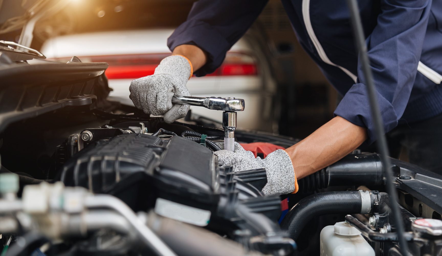 Mechanic Repairing Car